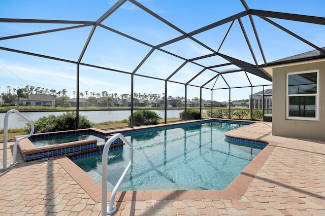 view of pool with a water view, a patio, glass enclosure, and an in ground hot tub