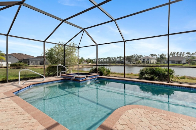 view of pool with an in ground hot tub, a lanai, a water view, and a patio