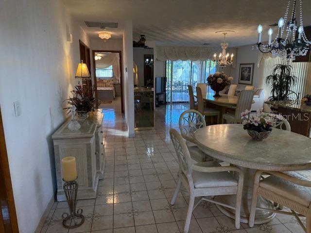 dining space with an inviting chandelier