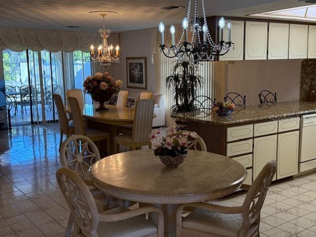 dining area with a notable chandelier