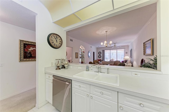 kitchen with dishwasher, sink, white cabinets, light colored carpet, and a notable chandelier