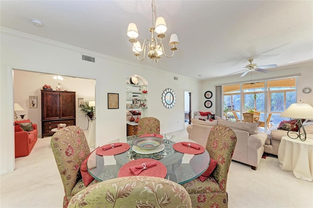 carpeted dining space with crown molding and ceiling fan with notable chandelier