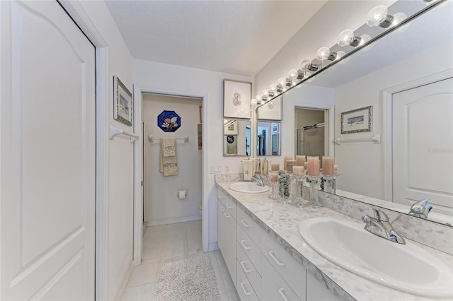 bathroom with vanity, walk in shower, toilet, tile patterned floors, and a textured ceiling