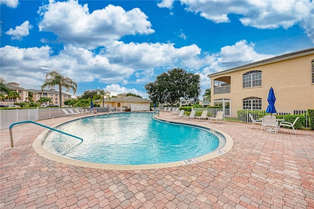 view of swimming pool with a patio