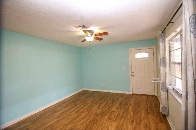 entrance foyer with hardwood / wood-style floors and ceiling fan