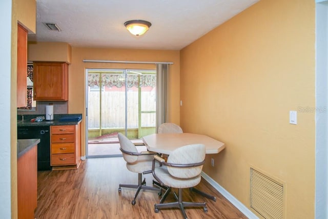 dining area with light hardwood / wood-style flooring