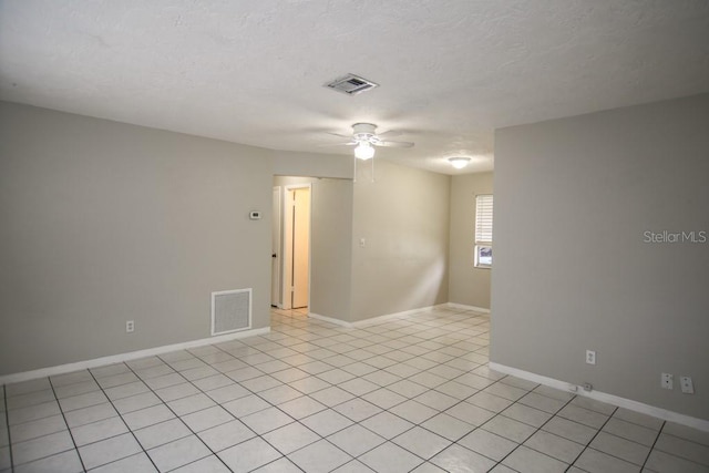 unfurnished room featuring light tile patterned floors and ceiling fan