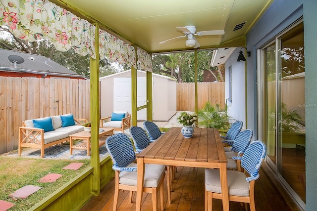 sunroom / solarium with ceiling fan and a healthy amount of sunlight