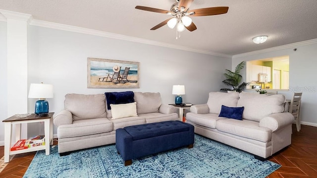 living room with ceiling fan, dark parquet flooring, ornamental molding, and a textured ceiling