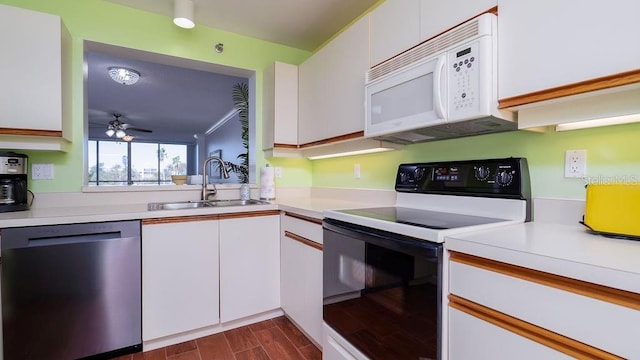 kitchen featuring sink, ceiling fan, electric range oven, white cabinets, and stainless steel dishwasher