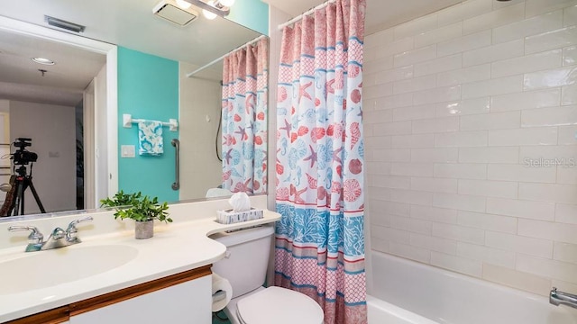 full bathroom featuring vanity, toilet, and shower / bath combo