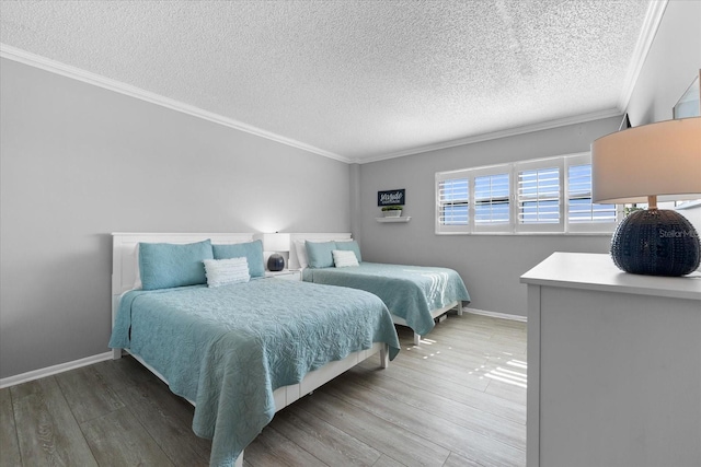 bedroom with crown molding, wood-type flooring, and a textured ceiling