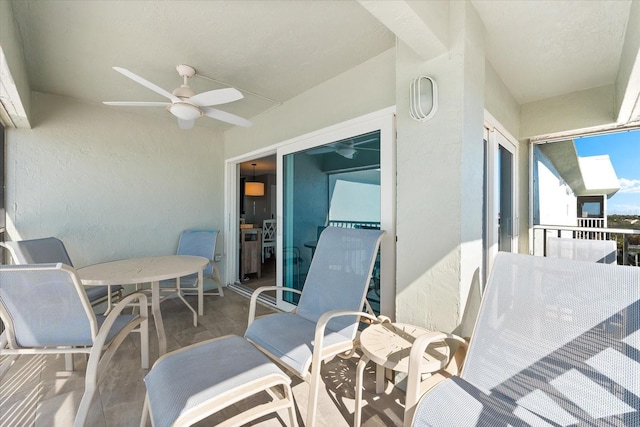 balcony featuring ceiling fan