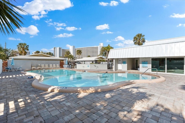 view of pool featuring a patio