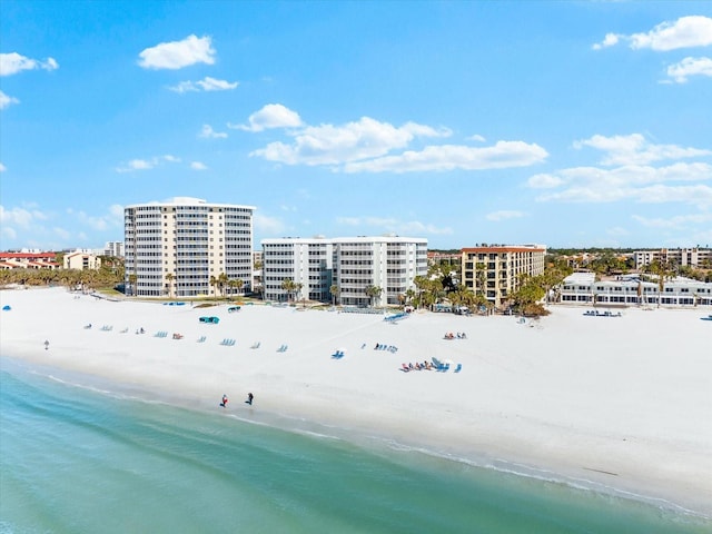 aerial view featuring a water view and a beach view