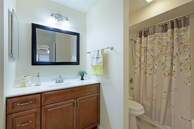 full bathroom with shower / tub combo, vanity, a textured ceiling, tile patterned floors, and toilet