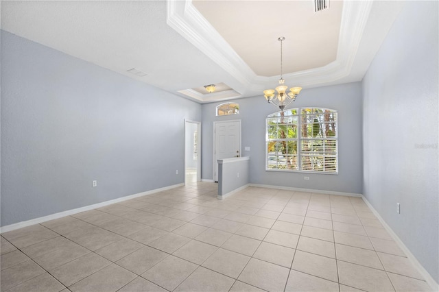 tiled empty room with a notable chandelier, ornamental molding, and a raised ceiling