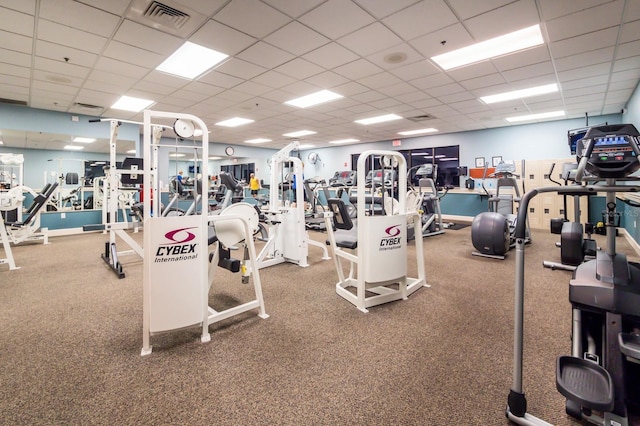 workout area featuring a paneled ceiling