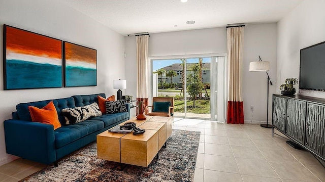 tiled living room featuring a textured ceiling