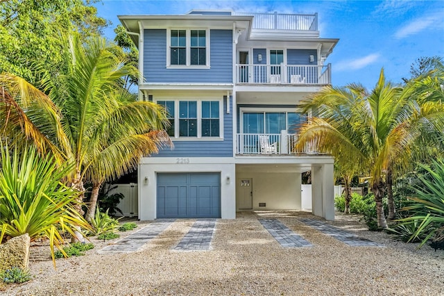 coastal home with a balcony and a garage