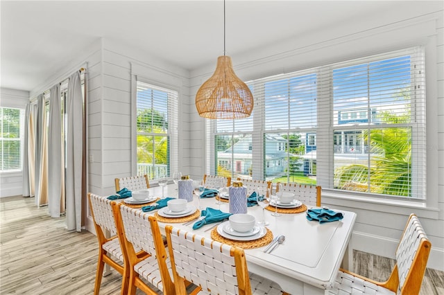 dining area featuring light hardwood / wood-style floors and a healthy amount of sunlight