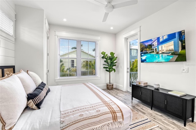 bedroom with ceiling fan, light hardwood / wood-style floors, and access to outside