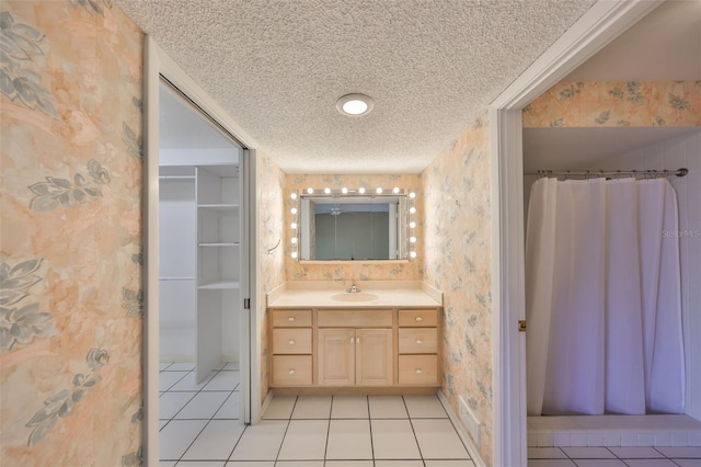 bathroom featuring vanity, tile patterned floors, and a shower with shower curtain