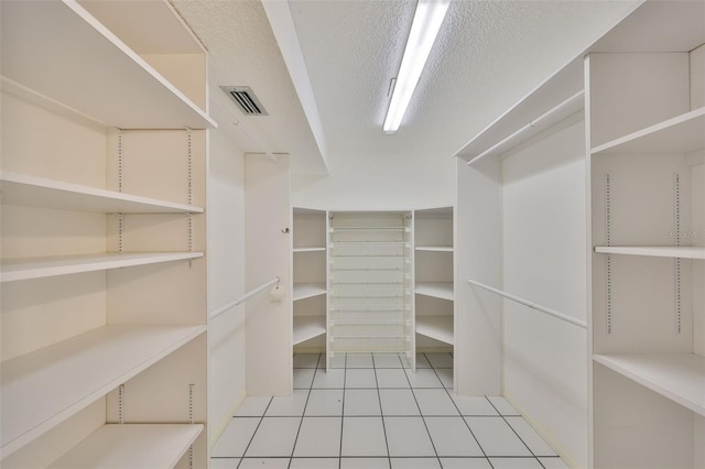 walk in closet featuring light tile patterned floors