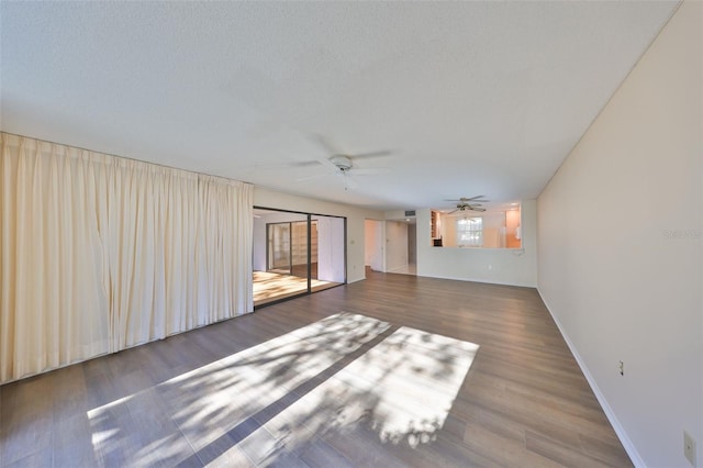 spare room with hardwood / wood-style floors and ceiling fan