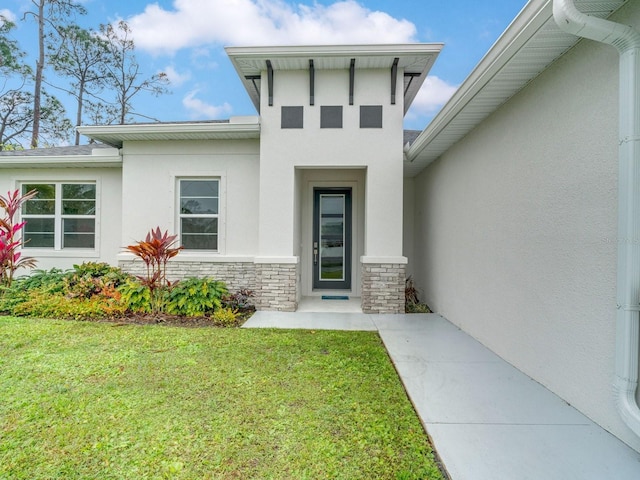 entrance to property with a yard