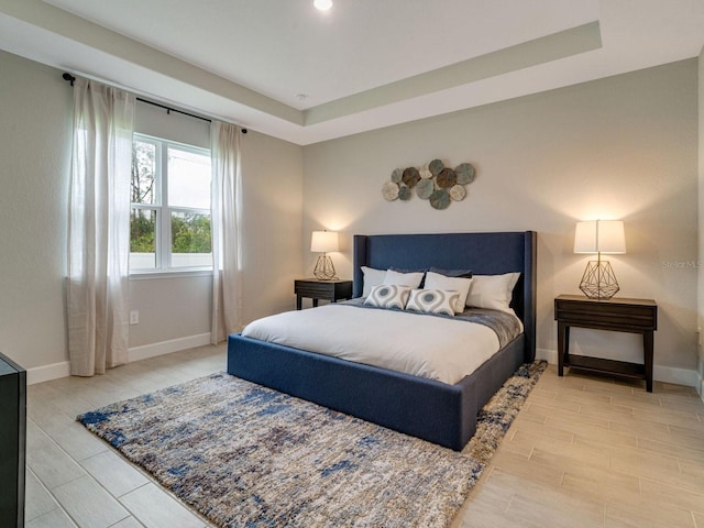 bedroom with a tray ceiling