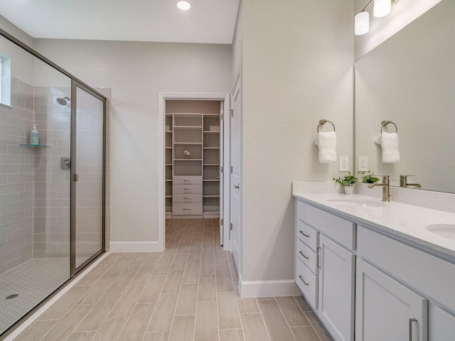 bathroom with vanity and an enclosed shower