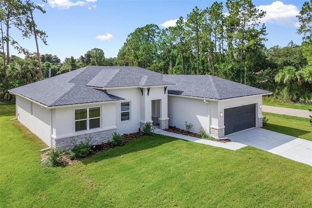 view of front facade with stucco siding, driveway, stone siding, a front yard, and a garage