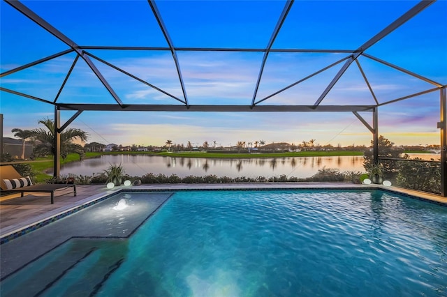 view of pool with a lanai and a water view