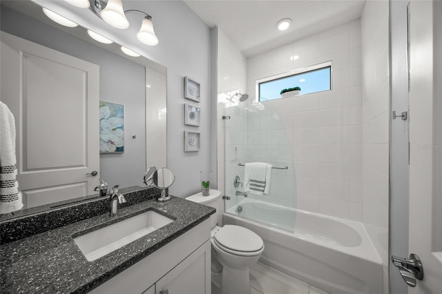 full bathroom with enclosed tub / shower combo, vanity, a textured ceiling, and toilet