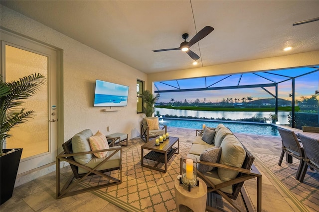 view of patio / terrace with a lanai, an outdoor hangout area, and ceiling fan