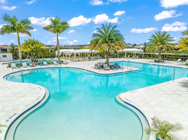 view of swimming pool featuring a gazebo and a patio