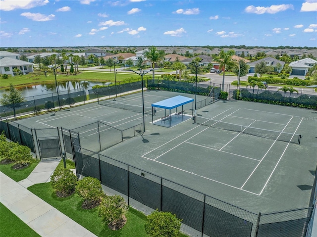 view of sport court featuring a water view