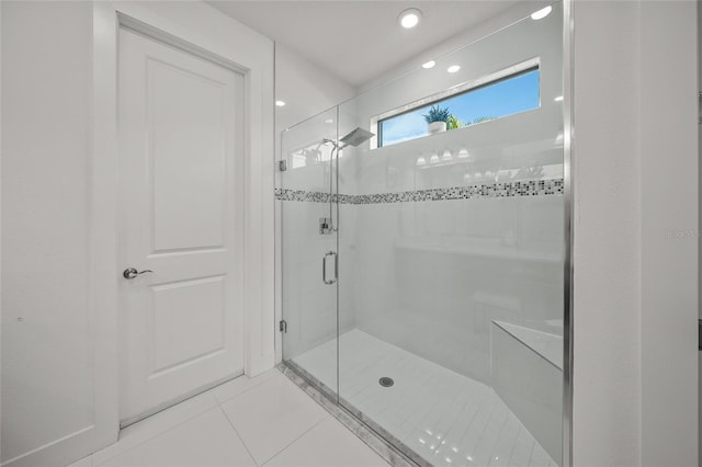 bathroom featuring tile patterned flooring and walk in shower