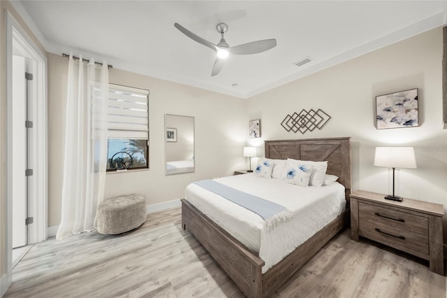 bedroom with ceiling fan and light wood-type flooring