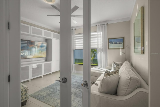 living room with light tile patterned flooring, ceiling fan, and french doors