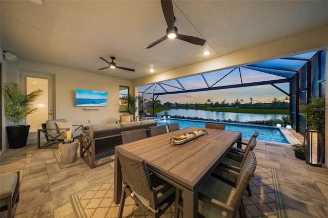 view of patio / terrace featuring ceiling fan, a lanai, and an outdoor hangout area