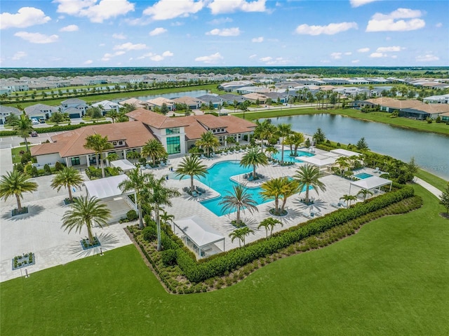 birds eye view of property with a water view