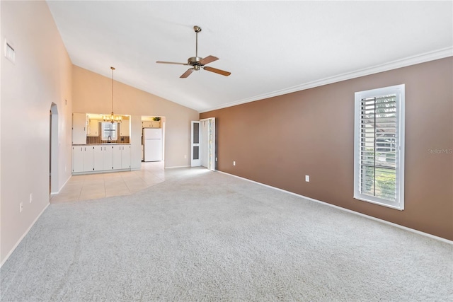 unfurnished living room with light carpet, ceiling fan with notable chandelier, lofted ceiling, and crown molding