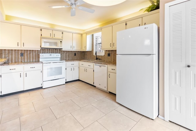 kitchen featuring sink, white appliances, decorative backsplash, and light tile patterned flooring