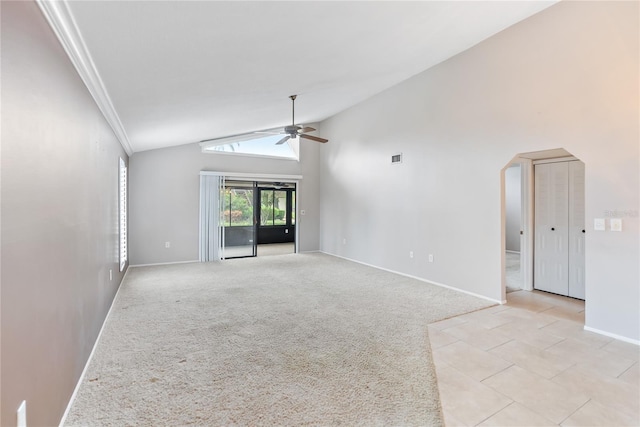 carpeted empty room featuring high vaulted ceiling, ceiling fan, and ornamental molding