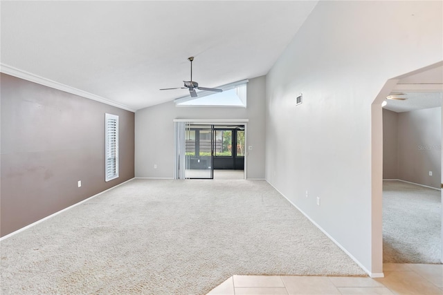 carpeted empty room featuring lofted ceiling and ceiling fan