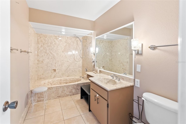 full bathroom with toilet, vanity, tiled shower / bath, and tile patterned flooring