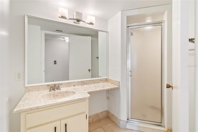 bathroom featuring vanity, tile patterned floors, and an enclosed shower