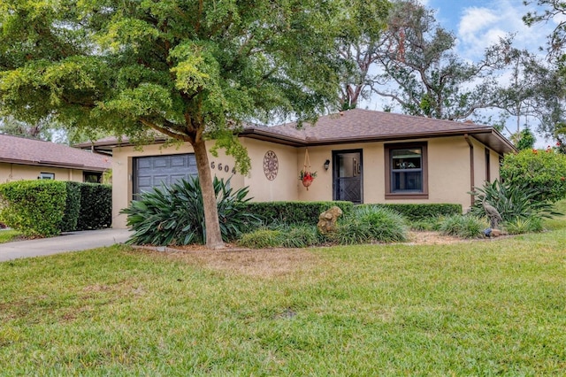 single story home featuring a garage and a front lawn